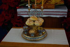 Image of bread rolls and other traditional Ukrainian food for Christmas Eve at the front of St. Demetrius Church 02 (Christmas Eve 2023).